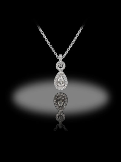 Stylish droplet shape pendant, with diamond entourage.