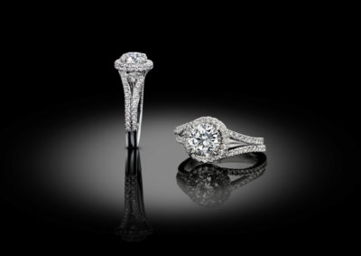 Contemporary engagement style solitaire ring entirely set with brilliant diamonds.