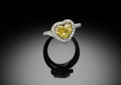 Beautiful ring, set with a fancy intense yellow heart shaped diamond.