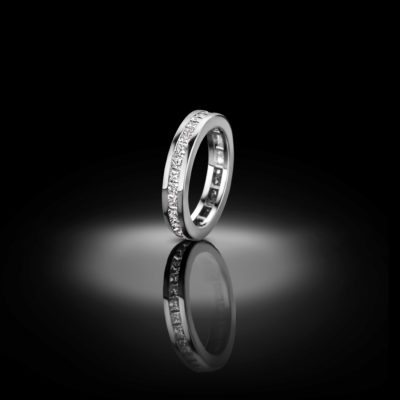 Timeless channel set eternity ring with princess cut diamonds.