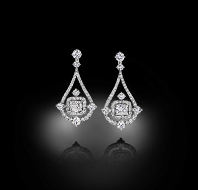 Droplet-shape earrings, build around a beautiful pair of diamond cushions.